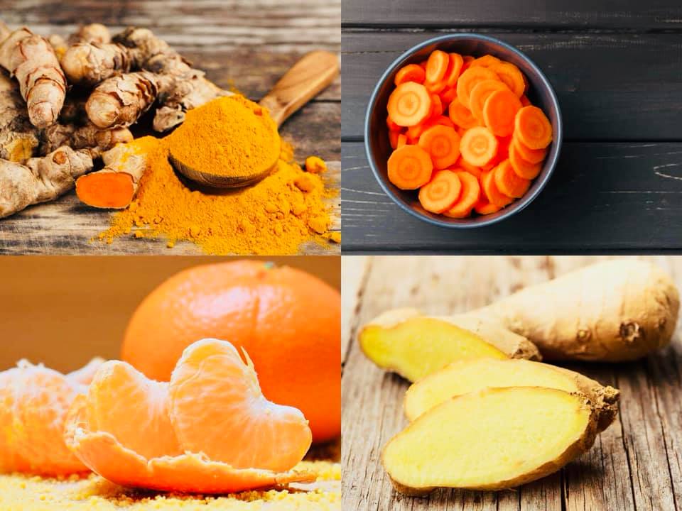 Bahan-bahan air detox berwarna oren dan kuning seperti lobak merah, oren, halia dan kunyit hidup yang dihiris.