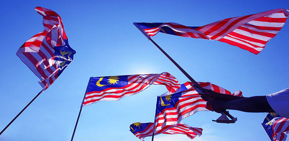 Gambar Jalur Gemilang berkibar bagi mewakili senarai lagu patriotik Malaysia