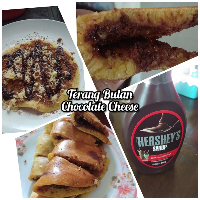 Sekeping kuih terang bulan atau apam balik dipotong dengan topping coklat, keju dan kacang.
